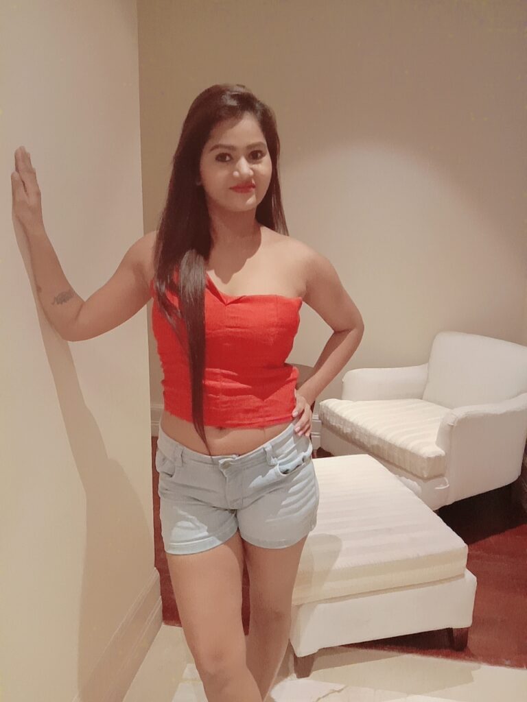 escort girl in red top and white short